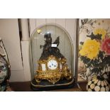 A 19th Century gilded mantle clock under glass dom