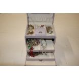 A jewellery box and contents of miscellaneous cost