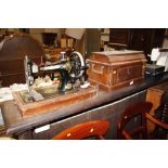 A Singer oak cased sewing machine