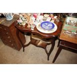 An Edwardian mahogany occasional table with under