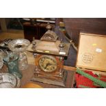An Edwardian walnut cased mantel clock