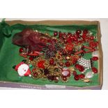 A tray of various red costume jewellery