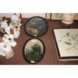 A pair of oval framed reverse painted pictures dep
