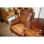 A late Victorian faux leather covered club chair A