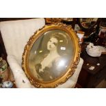 A portrait print in decorative oval gilt frame