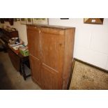 An antique stripped pine cupboard of shallow propo