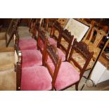 A set of six Edwardian carved walnut dining chairs