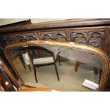 A large gilt framed overmantel mirror