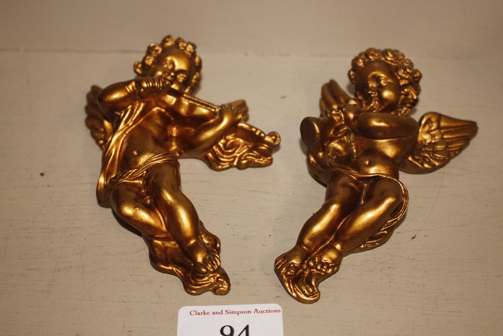 Two gilt cherub wall plaques