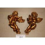 Two gilt cherub wall plaques