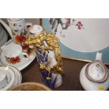 A Doulton gilt dragon decorated jug (chipped)