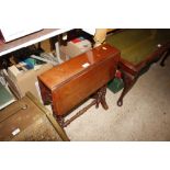 An Edwardian walnut Sutherland tea table