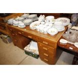 An early 20th Century oak pedestal writing desk