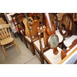 A set of four oak and barley twist dining chairs