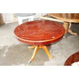 A reproduction circular top table