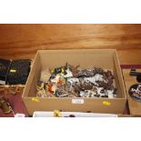A box containing various lead farm animals and hor