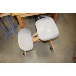 An ergonomic office stool on wheels