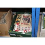 A box containing various comics