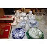 A quantity of leaf plates; rice bowls; floral deco