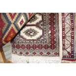 An approx 3'5" x 2' Eastern patterned rug