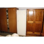 A white painted single door wardrobe