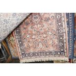 An approx 5'7" x 2'7" floral patterned rug