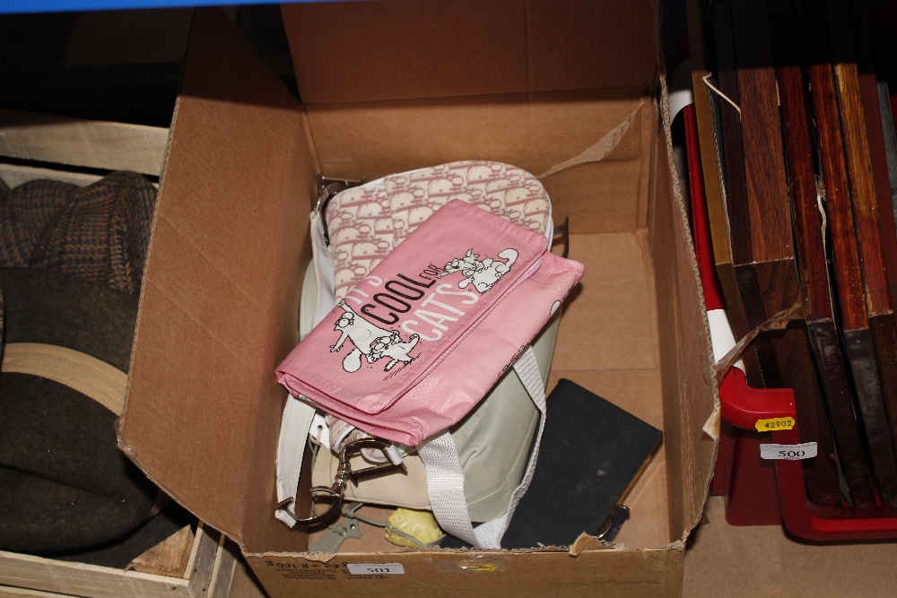 A box containing lady's handbags