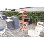 A wooden bird bath