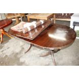A mahogany 'D' end extending dining table with one