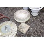 A concrete bird bath