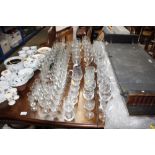 A large quantity of various drinking glasses