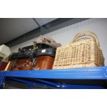 A quantity of suitcases and wicker baskets