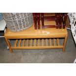 A beech two tier coffee table together with a nest