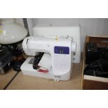 A Silver 1040 electric sewing machine in fitted ca