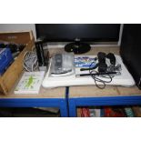 A Nintendo Wii with various accessories