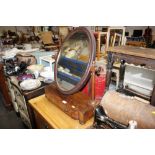 A 19th Century mahogany swing framed mirror raised