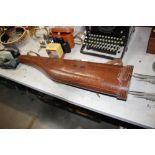 A leather leg of mutton shaped gun case