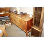 A Russel teak sideboard fitted three central drawe