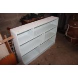 A painted open fronted bookcase