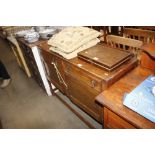 An oak sideboard raised on barley twist supports,