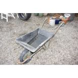 A plastic wheelbarrow