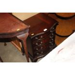 A mahogany serpentine fronted chest fitted four dr