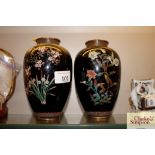 A pair of floral decorated cloisonné vases