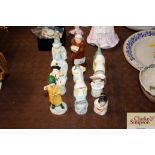 Eleven Royal Worcester candle snuffer figures and