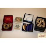 A quantity of various boxed bangles, brooches etc.