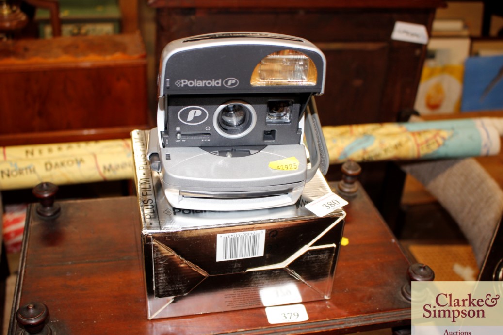 A Polaroid camera with original box