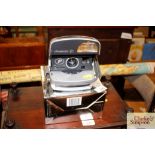 A Polaroid camera with original box