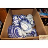 A box of various blue and white china