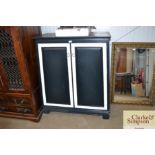 A black and white painted cupboard with two shelve