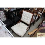 An upholstered and wooden Victorian easy chair